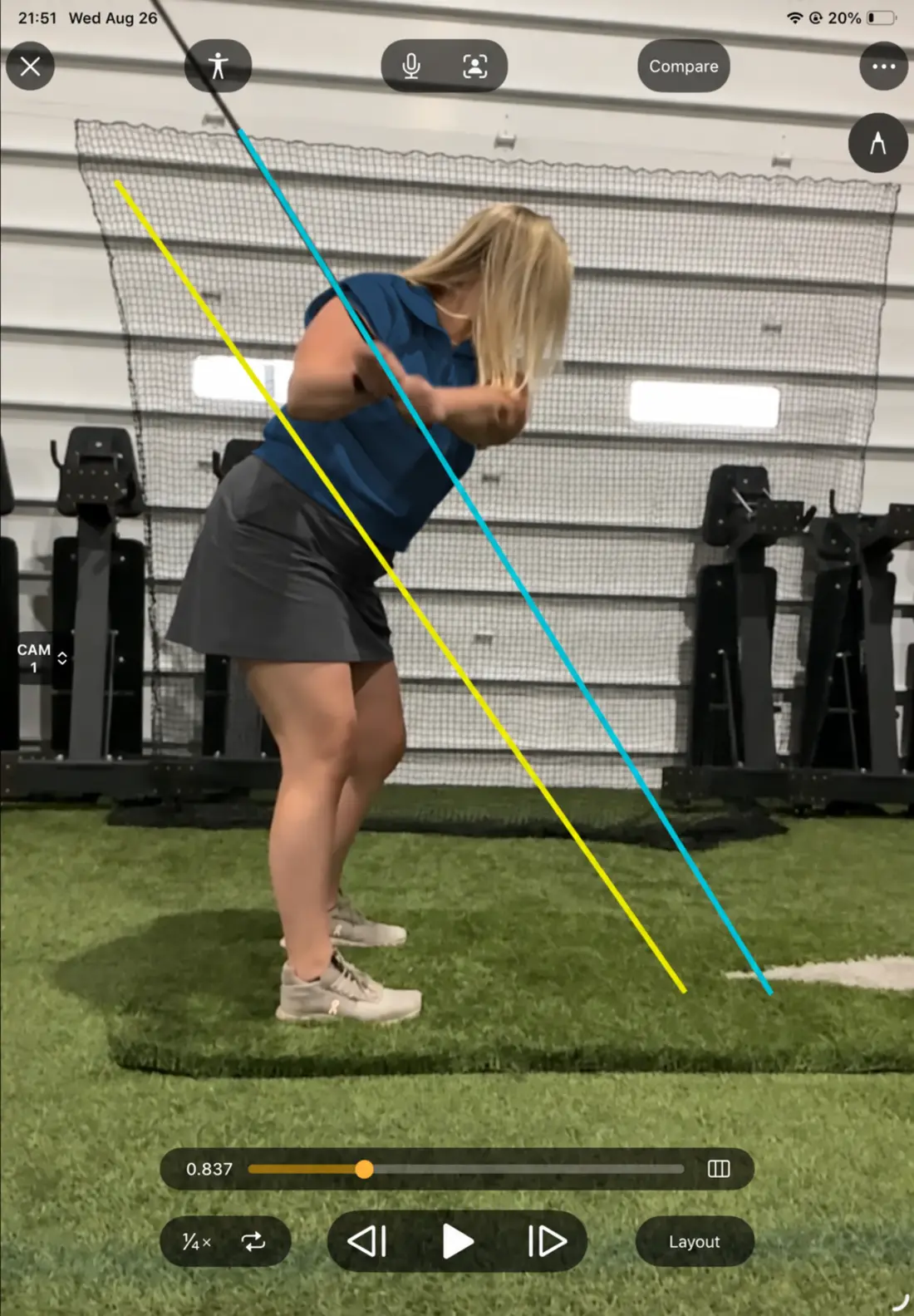 A golfer moving through the downswing during frame-by-frame swing analysis
