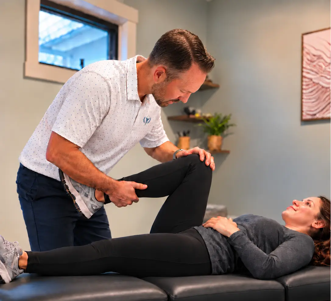 Michael Donohue, PT, DPT assessing a patient's hip and knee mobility