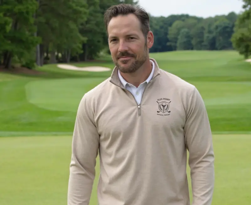 Michael Donohue, PT, DPT, founder of Flex Point Physical Therapy, standing on a golf course
