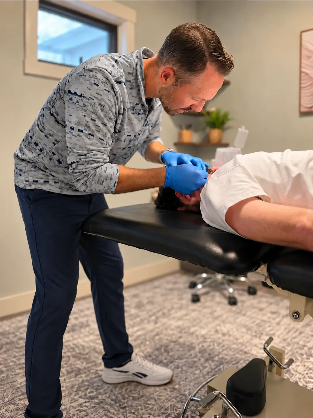 Michael Donohue, PT, DPT providing hands-on physical therapy treatment
