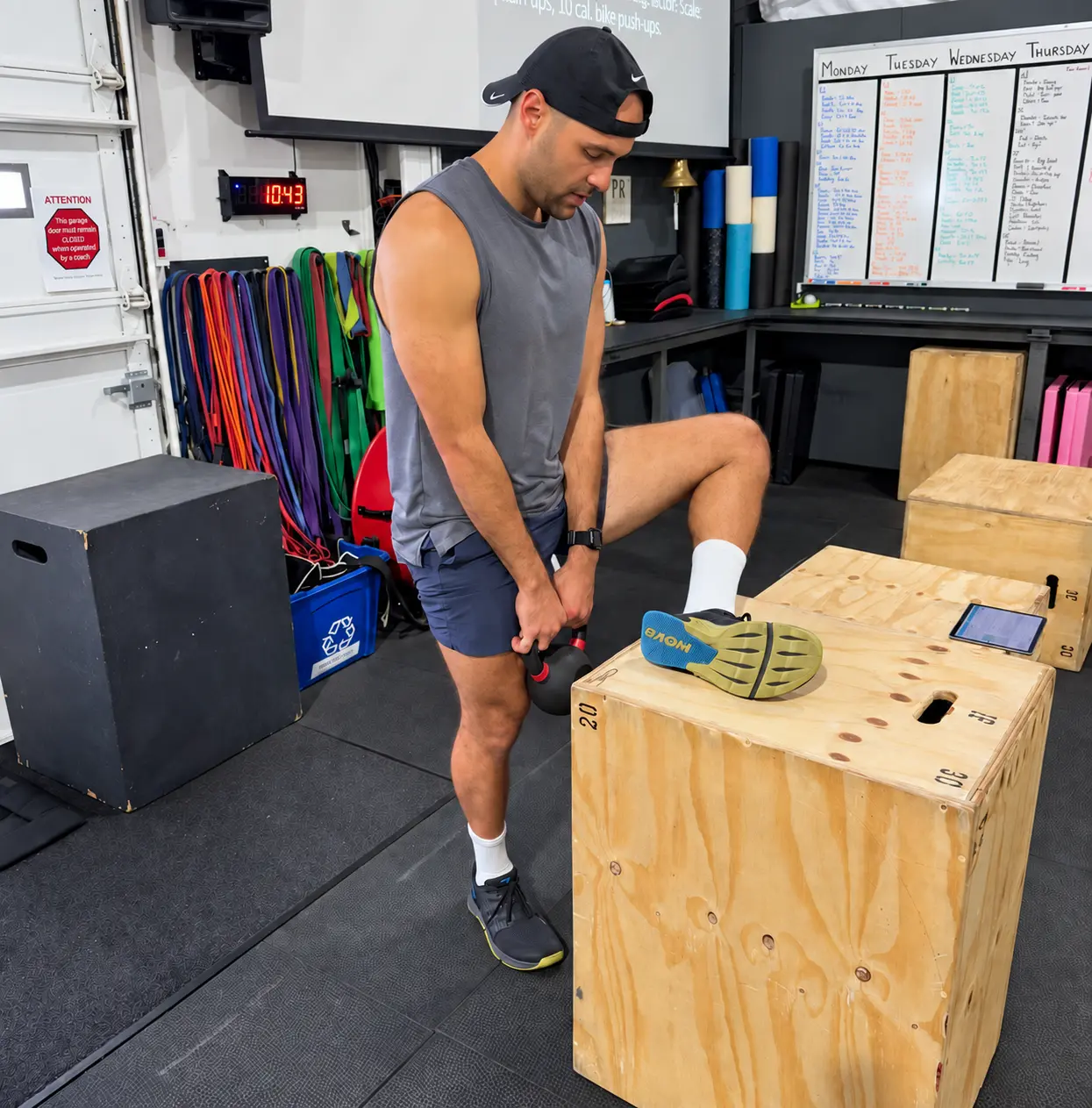 An active adult completing a loaded mobility exercise in the gym